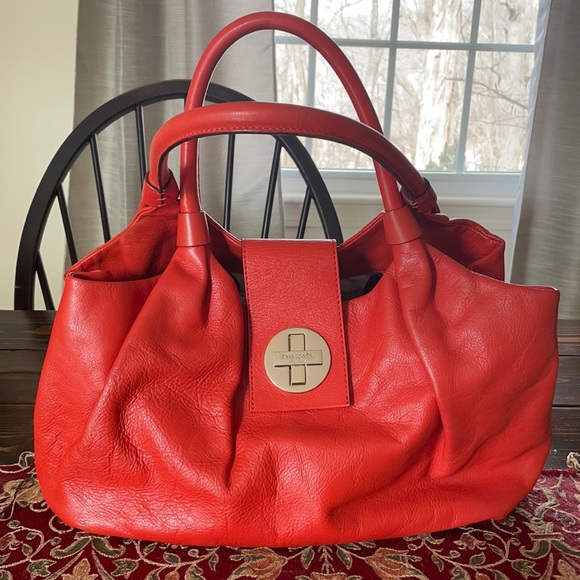 kate spade Handbags - Kate Spade Happy Orange Pebbled & Creased Leather Bag w Polka Dot Inside Lining